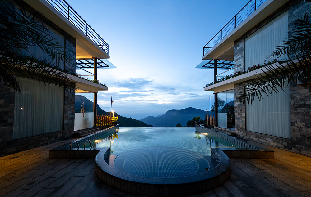 Peaceful outdoor lawn and resort facilities at Misty Fern family resort in Munnar